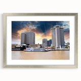 Textured abstract art print of New Orleans skyline in muted earth tones on framed silver canvas, suitable for bedroom decor.