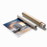 Large rolled canvas print of New Orleans scenery with lush floral elements in muted greens and blues.