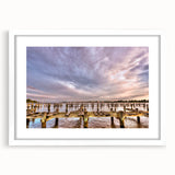 Abstract art print of Annapolis, Maryland, with muted blue and green hues on a framed white mat, ideal for dining room decor.