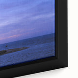 Black wall art featuring a textured depiction of Nantucket, with colorful accents on a framed canvas.