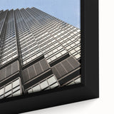 Close-up of extra large black wall art featuring a textured Minneapolis skyline in vibrant colors on framed canvas.