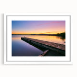 Abstract art print of Minnesota scenery in muted earth tones, framed with a white mat, suitable for dining room decor.