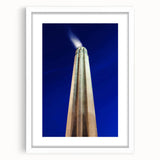 Abstract art print of Kansas City skyline in muted gray and blue tones on a framed white mat, ideal for dining room decor.