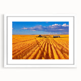 Abstract art print depicting a serene Montana landscape in soft blue and green tones, framed in white.