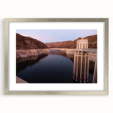 Textured art of Hoover Dam in muted gray, framed in silver, ideal for modern bedroom decor.