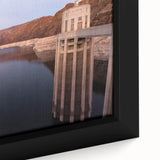 Close-up of textured black wall art depicting Hoover Dam, with vibrant colorful accents, in a framed canvas format.