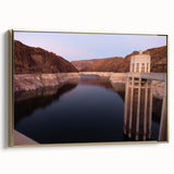 Framed canvas of Hoover Dam in vintage poster style with a gold frame, featuring black and gray tones.