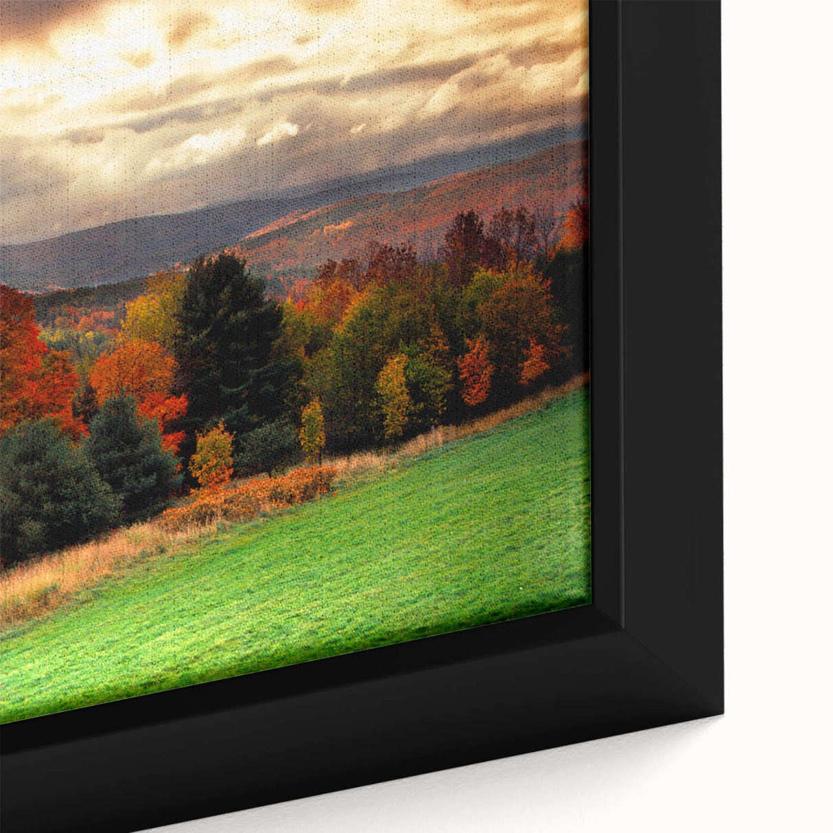 Close-up of a textured black wall art depicting a vibrant New Hampshire scenery on a framed canvas.