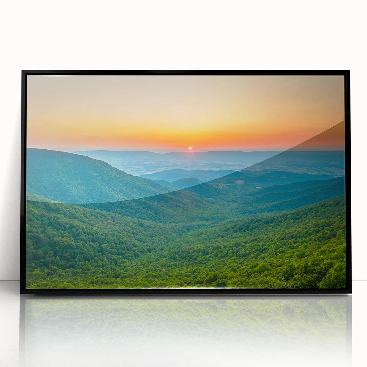 Large abstract wall art depicting the Blue Ridge in North Carolina, in muted blue and green tones on a black framed acrylic.