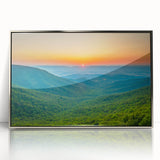 Mid-century modernist art depicting the Blue Ridge Mountains in muted blue and green hues on a silver-framed acrylic print.