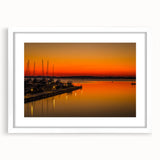 Abstract art print of Charlotte skyline in muted gray and blue tones on a framed white mat, suitable for dining room decor.