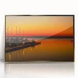 Acrylic print of Charlotte, North Carolina skyline in gold tones, framed, ideal for modern art wall decor.