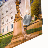 Large abstract wall art depicting the Raleigh skyline in muted blue and gray tones on acrylic glass.