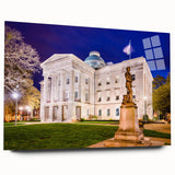 Large abstract wall art of Raleigh skyline in muted gray and blue tones on acrylic glass.