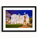 Abstract art print of Raleigh skyline in vibrant colors on a large, framed canvas, ideal for living room decor.