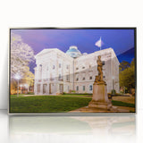 Mid-century modernist art of Raleigh skyline in muted blue and silver tones on framed acrylic.