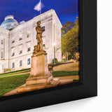 Framed canvas featuring a textured depiction of Raleigh, North Carolina, in black with vibrant colorful accents.