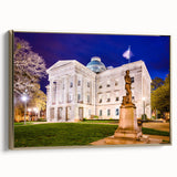 Framed canvas of Raleigh, North Carolina landscape with vintage poster style, featuring black and gold tones.
