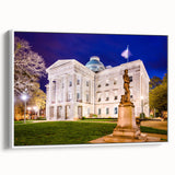 Vintage poster art of Raleigh, North Carolina on framed canvas, featuring vibrant colorful art on a black background.