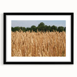 Abstract art print of a textured, colorful North Dakota scenery in a black frame, ideal for large living room walls.