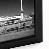 Black wall art featuring a textured depiction of Coney Island in vibrant colors on a framed canvas.