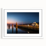 Abstract art print of Long Island scenery in muted blue and green tones on a framed white mat, ideal for dining room decor.