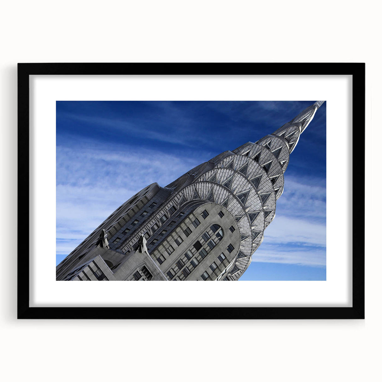 Extra large abstract art print of the Chrysler Building in colorful, textured style, framed with a black mat.