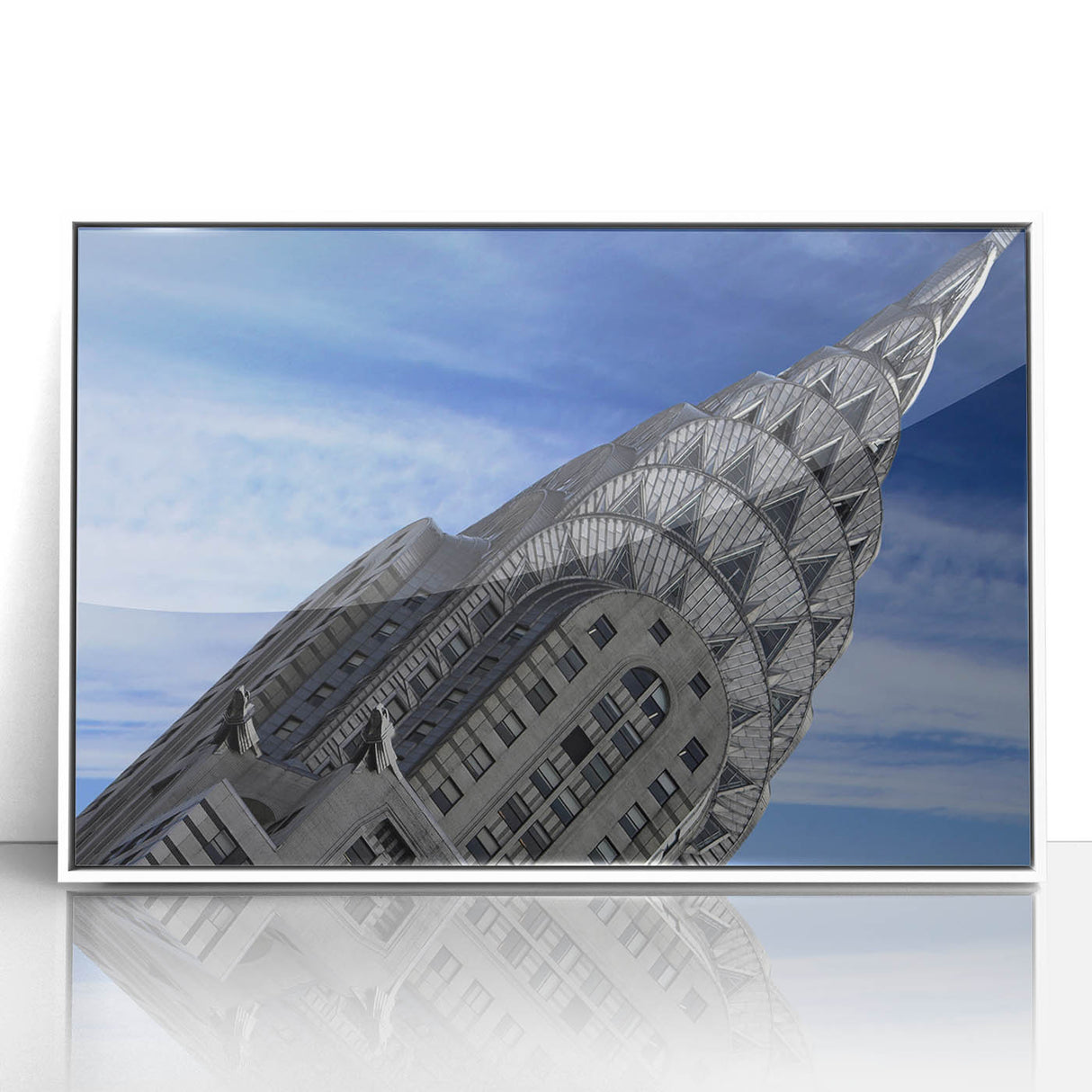 Art deco poster of the Chrysler Building in muted gray and white tones on a framed acrylic.