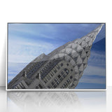 Art deco poster of the Chrysler Building in muted gray and white tones on a framed acrylic.
