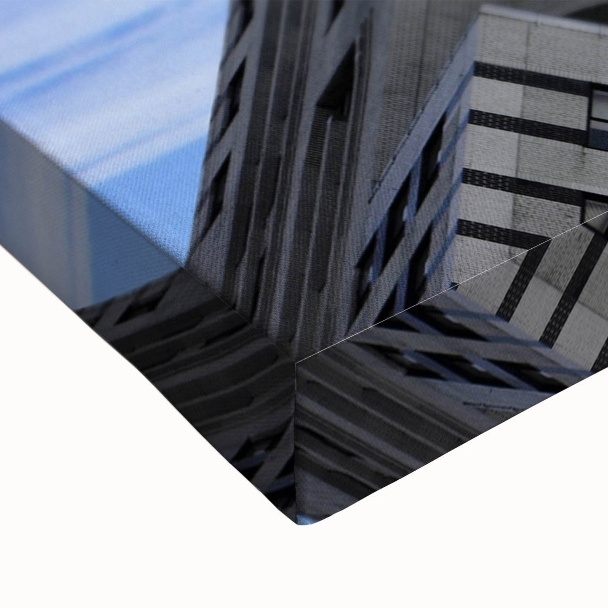 Close-up of a large art piece depicting the Chrysler Building in black and white on stretched canvas.