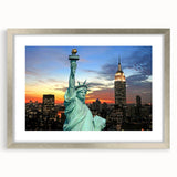 Textured abstract art print of NYC skyline in muted grays and blues, framed in silver, ideal for modern bedroom ambiance.