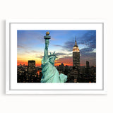 Abstract art print of the NYC skyline in muted gray and blue tones, framed with a white mat.