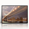 Acrylic print of the Manhattan Bridge in muted gray, framed in black, suitable for modern art wall decor.