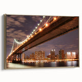 Framed canvas of Manhattan Bridge in vintage poster style, featuring black and gold tones, ideal for bedroom wall art.