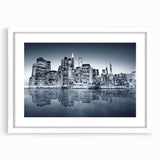 Abstract art print of Manhattan skyline in muted gray and blue tones on a framed white mat, ideal for dining room decor.