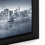Extra large black wall art featuring a textured Manhattan skyline in colorful hues on a framed canvas.