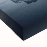 Large art of Manhattan skyline in black and white on stretched canvas, suited for bedroom wall.