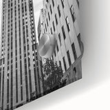 Large abstract depiction of NYC Rockefeller in muted grays and blues on acrylic glass, suitable for dining room art.