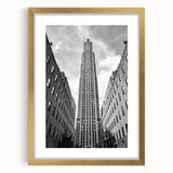 Extra large abstract art print of NYC Rockefeller scenery in gold frame, ideal for living room decor.