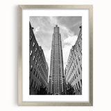 Textured abstract art print of NYC Rockefeller, in muted gray and silver tones, framed with mat.