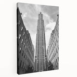 New York City skyline at dusk depicted in muted gray and blue tones on a large stretched canvas.