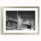 Textured art print of the Statue of Liberty in abstract style, with muted blue and gray tones on a silver-framed mat.