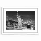 Abstract art print of the Statue of Liberty in muted gray tones, framed with a white mat.