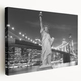 Side view of a large art print depicting the Statue of Liberty in muted green and blue tones on stretched canvas.