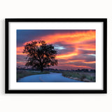 Abstract art print depicting colorful, textured scenery of Oklahoma in a large black frame, ideal for living room decor.