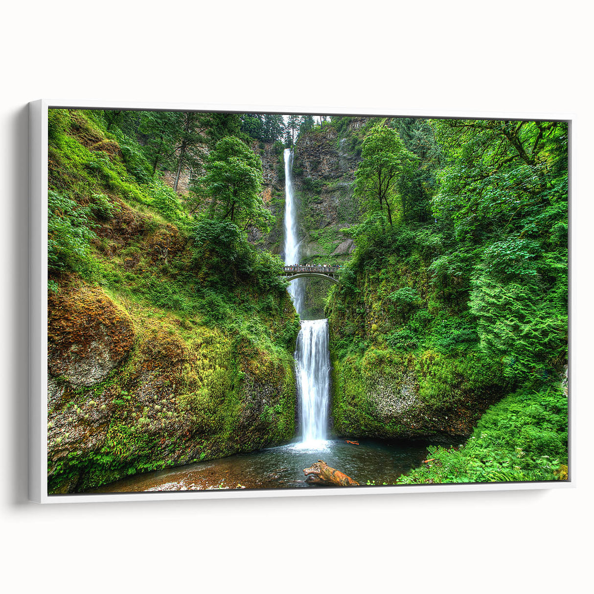 Vintage poster art of Multnomah Falls, Oregon on a large framed canvas, featuring vibrant greens and blues.