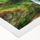 Art deco poster of Multnomah Falls in Oregon, featuring soft green and blue tones on a rolled canvas.
