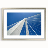 Textured art print of abstract Charleston scenery in muted earth tones, framed in silver, suitable for bedroom decor.