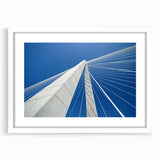 Abstract art print of Charleston scenery in muted blue and green tones on a framed white mat, suitable for dining room decor.