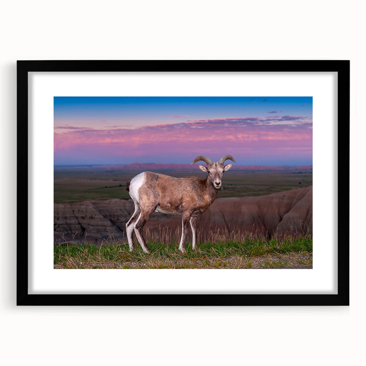 Extra large abstract art print of South Dakota Badlands in vibrant colors on a textured canvas, framed in black.